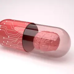 Czerwona kapsułka z obwodami drukowanymi zawiera mózg. Symbolizuje to potencjalne leki, takie jak inhibitory MAO, które wpływają na funkcje mózgu.